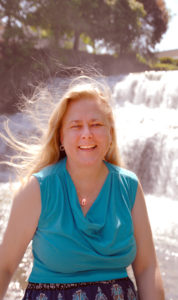 Colleen Kulikowski sitting in front of Glenn Falls in Williamsville NY.