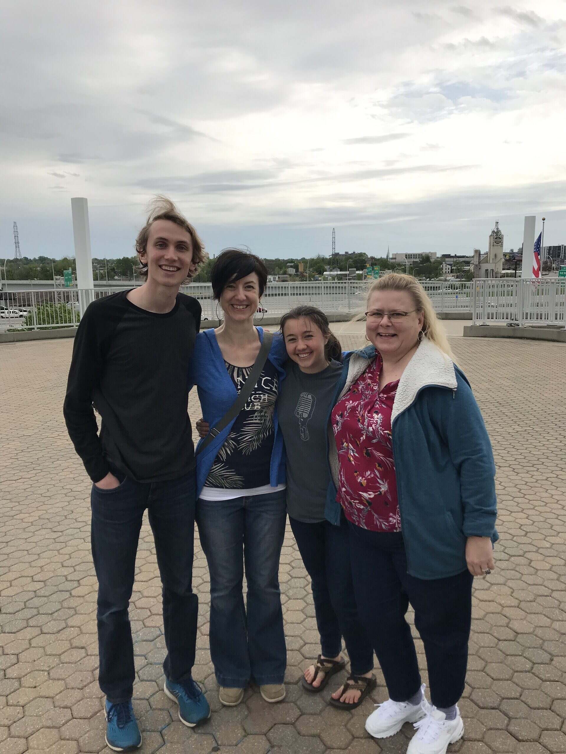 Colleen with students on the bridge