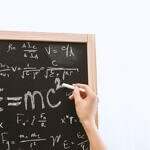 Image of a chalkboard with various science formulas.