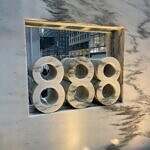 three eights engraved in marble