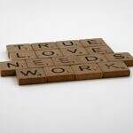 true love is different. Image of scrabble tiles spelling out true loveneeds work