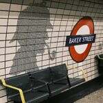 Arthur Conan Doyle Image of a subway station at Baker Street with the shadow of Sherlock Holmes on the wall.