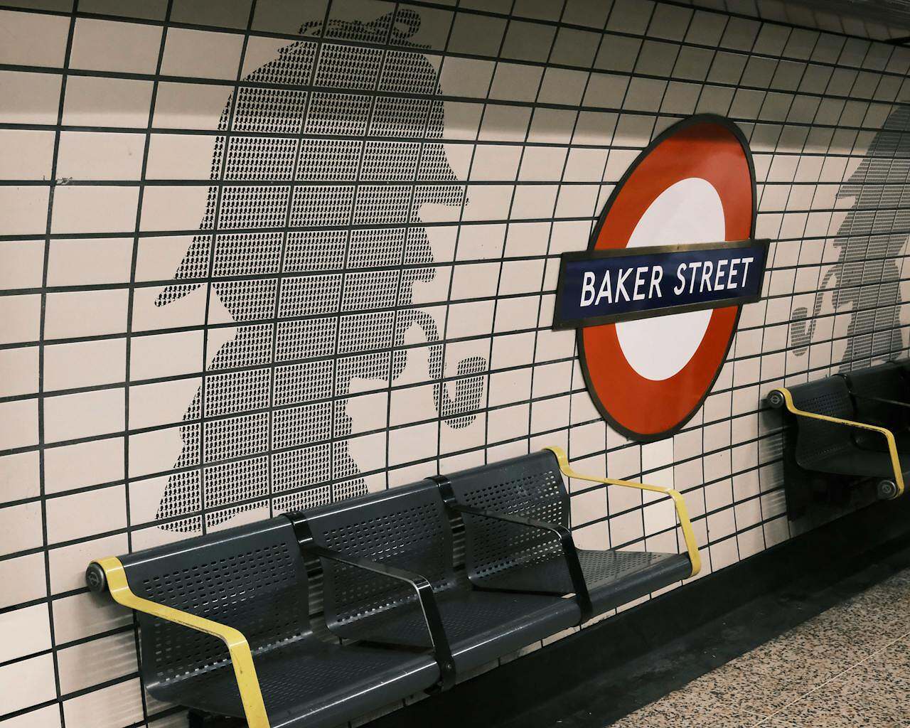 Arthur Conan Doyle Image of a subway station at Baker Street with the shadow of Sherlock Holmes on the wall.