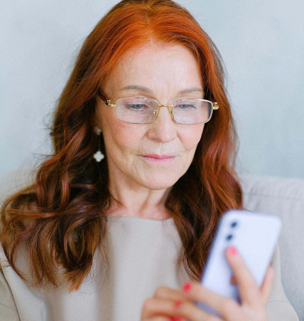 Who Can Help Me Reconnect with My Purpose? Image of a woman looking at a cell phone.