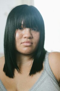 Image of a woman staring confidently into the camera