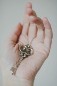 Image of a hand holding a key