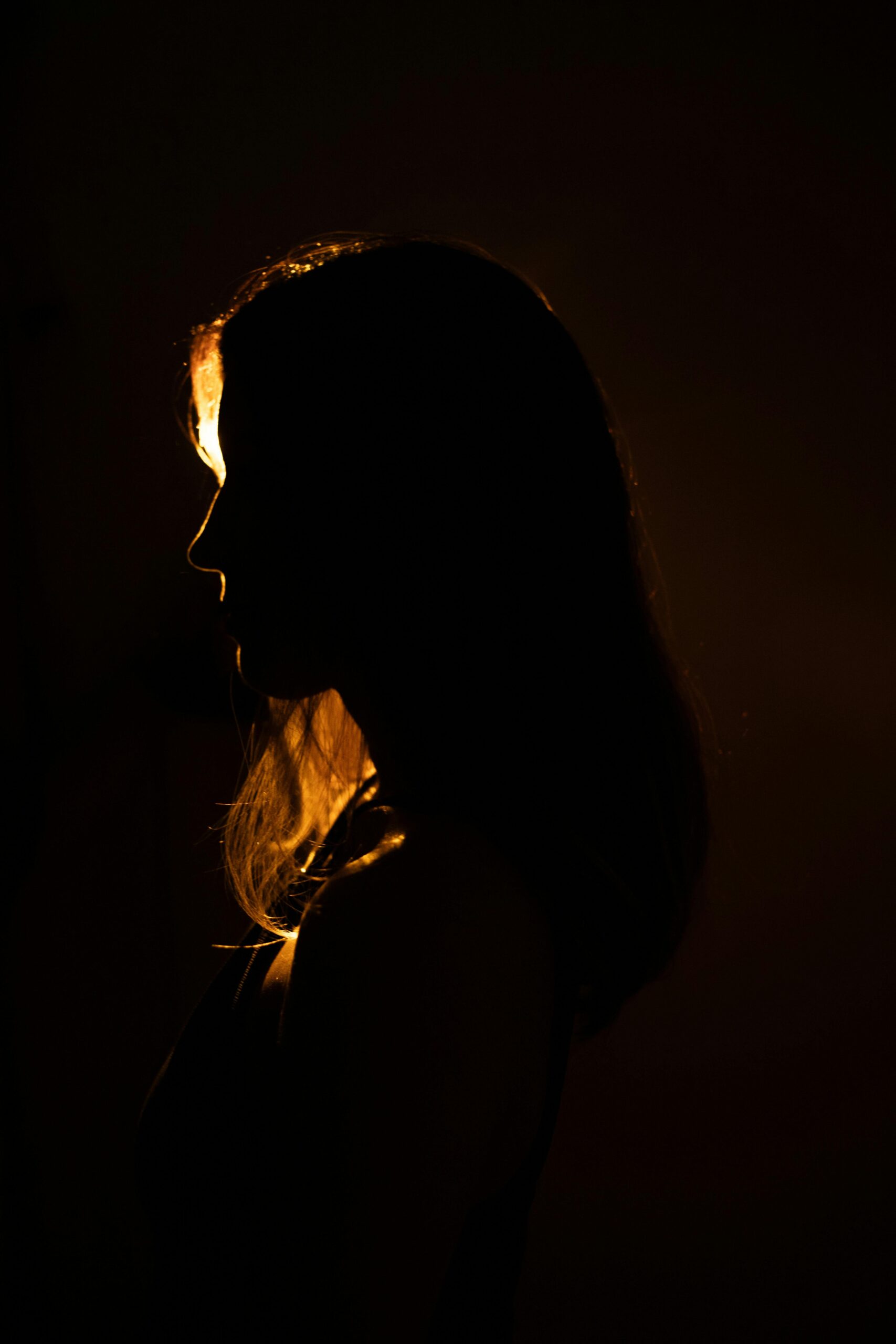 Image of a woman in shadow.