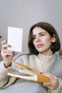 Image of a woman with a photo. Connect to a Photo