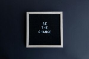 Image of a sign "be the change"