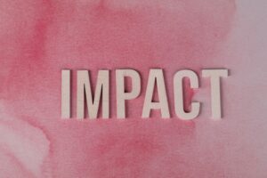 Image of the word impact on a pink background. this article is talking about Healing and Influence
