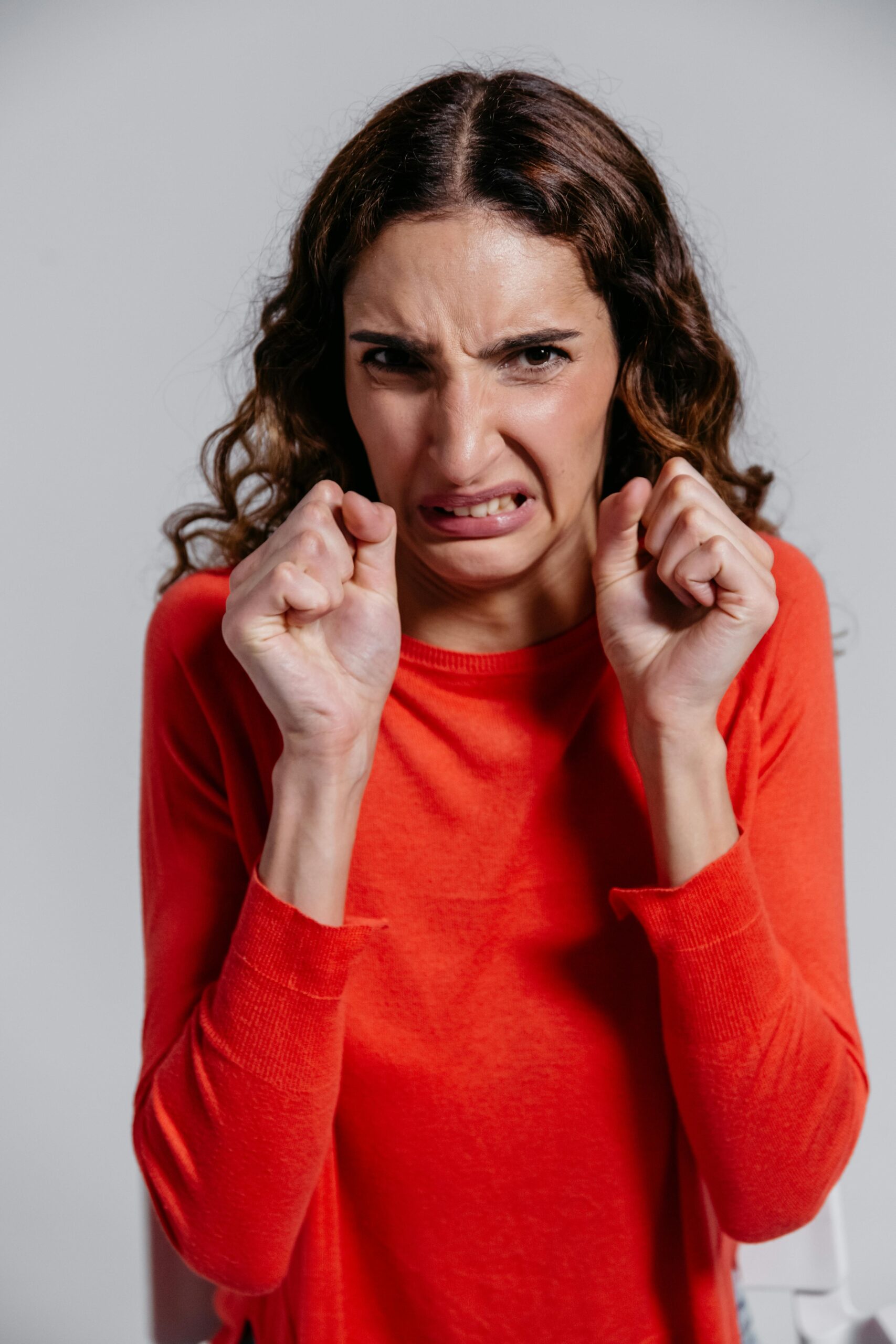 Image of a woman looking scared.