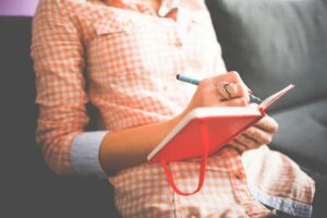 Image of a woman journaling