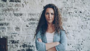 Image of a woman looking at the camera quizzical.