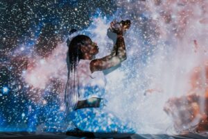 Image of a woman with a cosmic overlay