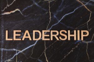 image of the word leadership in gold lettering on a black marble slab