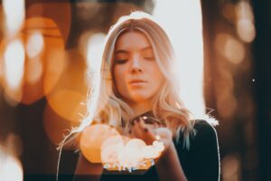 Image of a woman holding light
