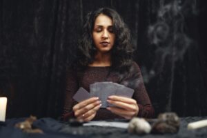 Image of a woman reading Tarot Cards