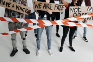 Image of a group of people with signs protesting.