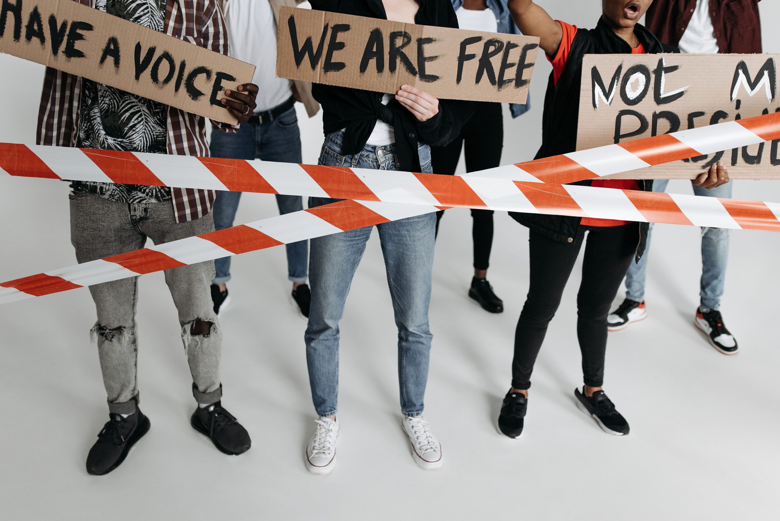 Image of a group of people with signs protesting.