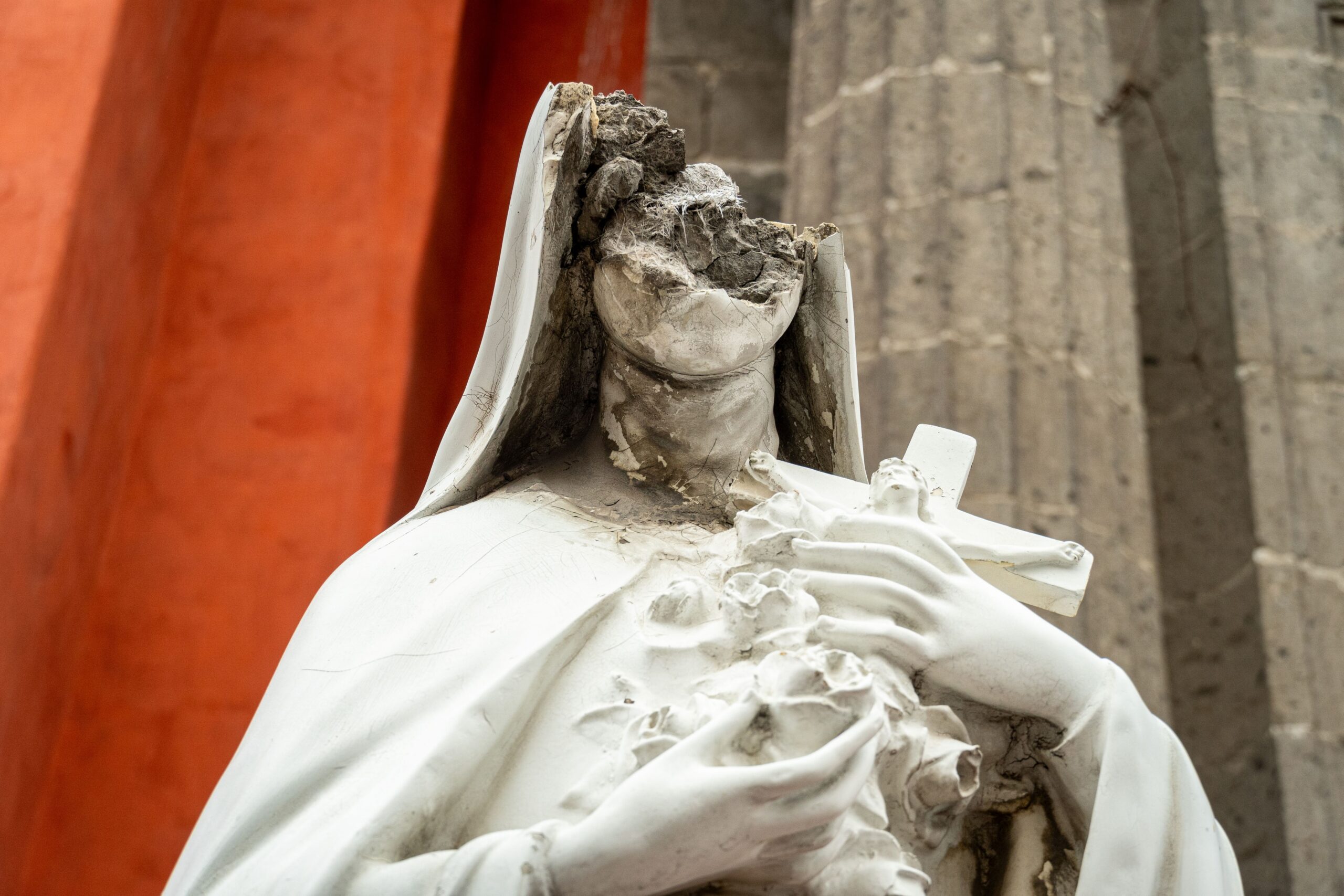 Image of a broken and worn religious statue