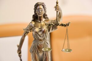 Image of a statue of justice holding scales.