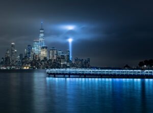 Image of the NYC skyline with the lights illuminating where the towers were.
